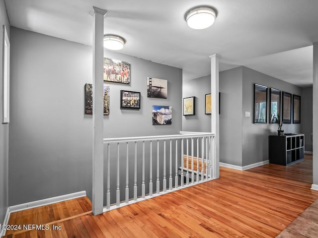 corridor featuring hardwood / wood-style floors