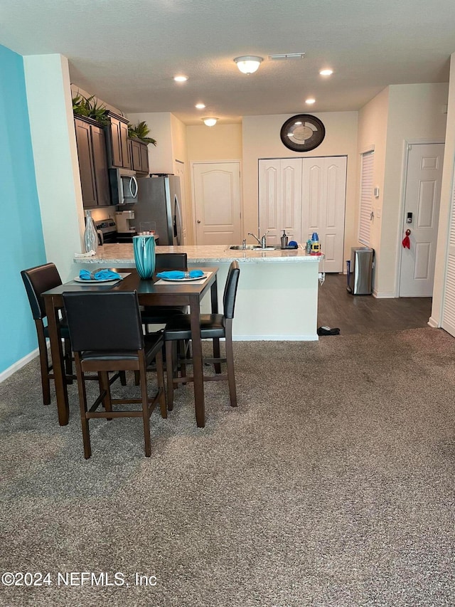 dining room with dark carpet