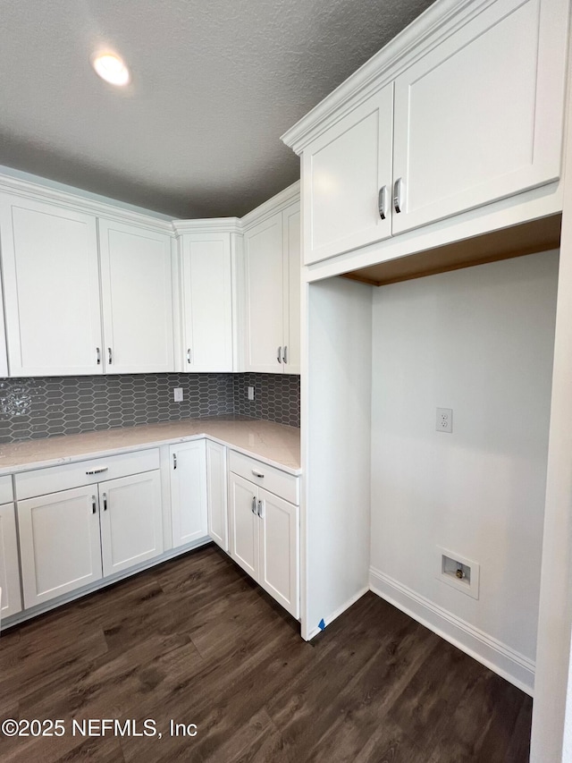 88 Latham Dr, Ponte Vedra, FL 32081 - kitchen featuring white cabinetry, dark wood-style flooring, decorative backsplash, baseboards, and light countertops