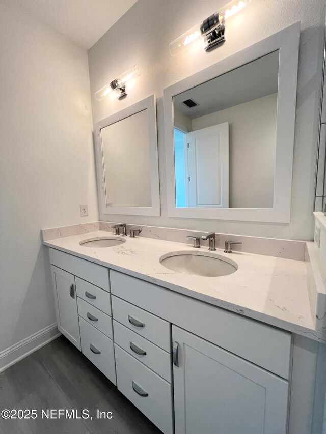 88 Latham Dr, Ponte Vedra, FL 32081 - bathroom with double vanity, wood finished floors, and baseboards
