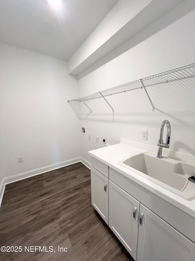 88 Latham Dr, Ponte Vedra, FL 32081 - washroom with electric dryer hookup, dark wood-style flooring, washer hookup, baseboards, and cabinet space