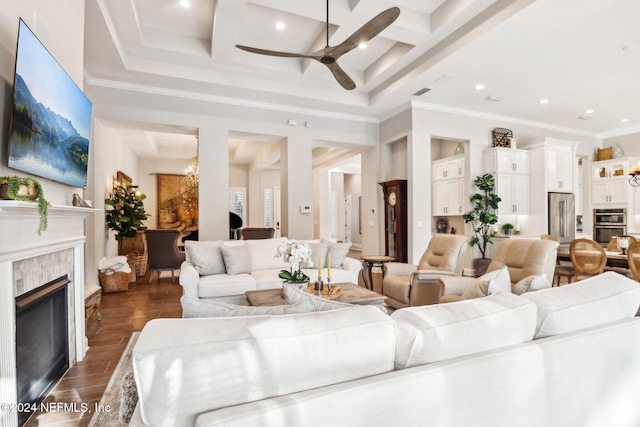 living room with ceiling fan, dark wood-type flooring, coffered ceiling, beamed ceiling, and crown molding