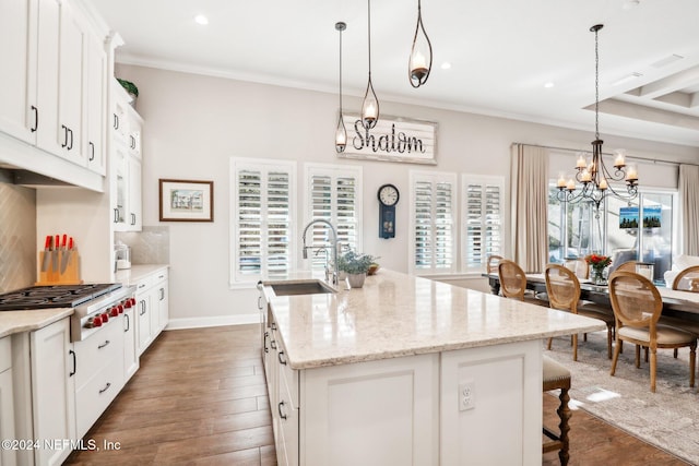 kitchen featuring sink, stainless steel gas cooktop, dark hardwood / wood-style floors, a center island with sink, and white cabinets