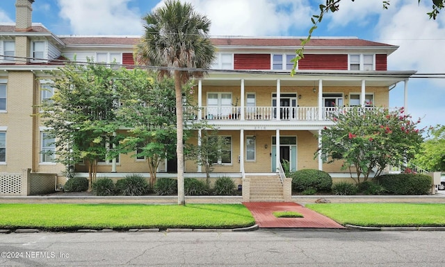 view of front facade with a balcony