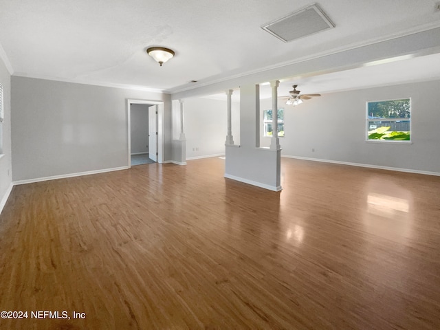 spare room with ceiling fan, dark hardwood / wood-style flooring, and ornamental molding