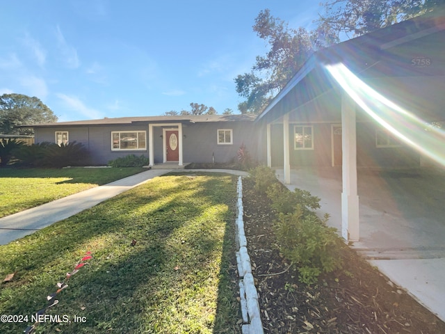 ranch-style home with a front yard