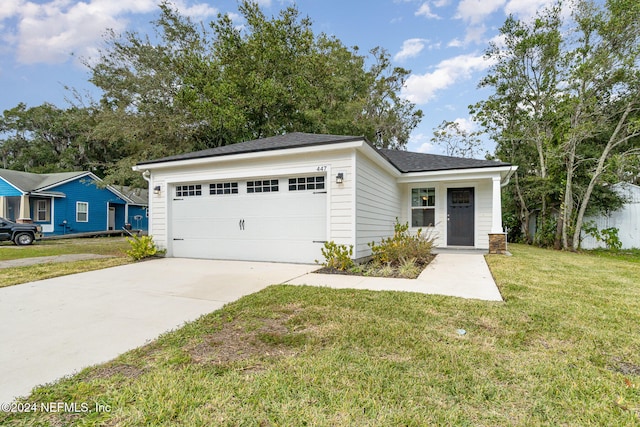 ranch-style home with a front yard and a garage