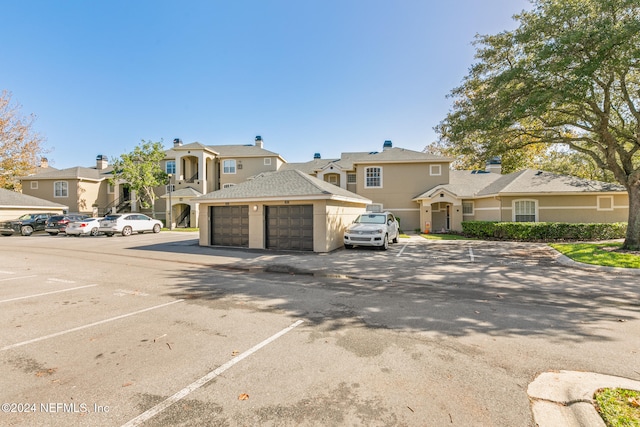 front of property with a garage