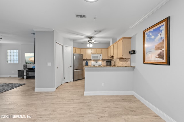 kitchen with white appliances, crown molding, light wood-type flooring, tasteful backsplash, and kitchen peninsula