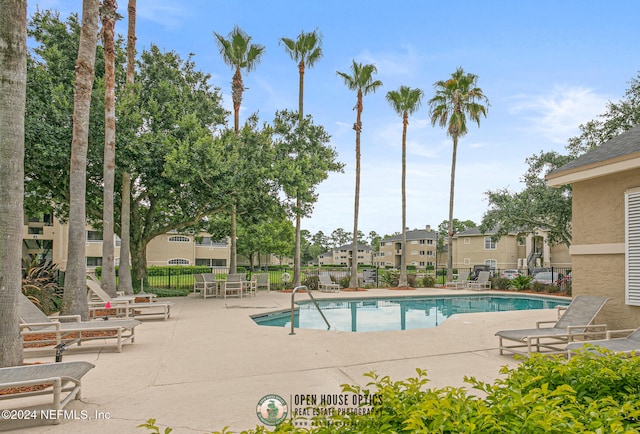 view of swimming pool featuring a patio area