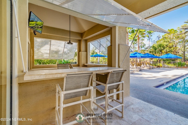 view of patio with a bar