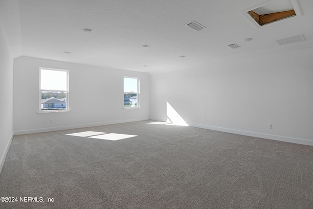 unfurnished room featuring carpet flooring