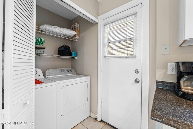 laundry room featuring light tile patterned flooring and independent washer and dryer