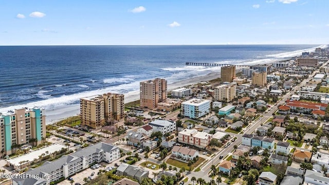 bird's eye view featuring a water view and a view of the beach