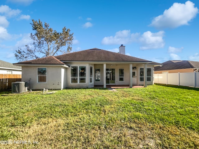 9767 Brockham Ct, Jacksonville, FL 32221 - back of house with stucco siding, a chimney, central AC unit, a patio, and roof with shingles
