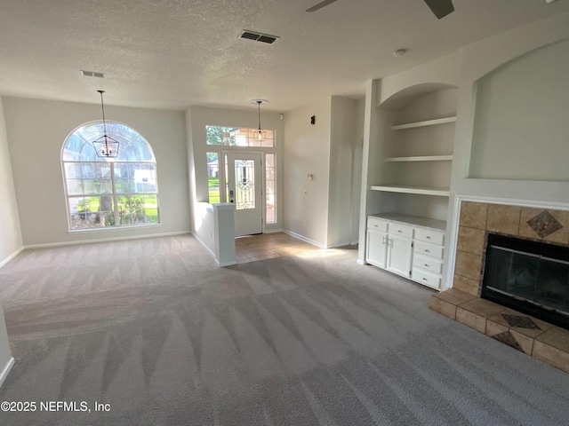 9767 Brockham Ct, Jacksonville, FL 32221 - unfurnished living room featuring carpet floors, baseboards, plenty of natural light, and a textured ceiling