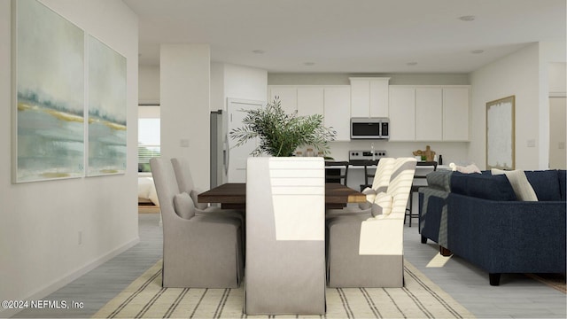 dining room with light hardwood / wood-style floors