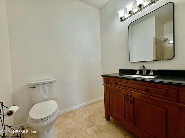 bathroom featuring tile patterned flooring, a shower, vanity, and toilet