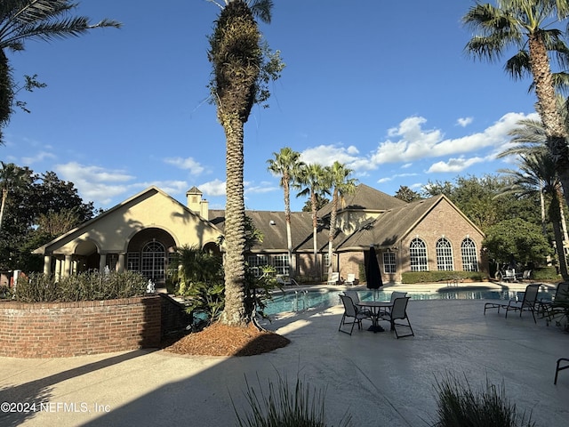 view of swimming pool featuring a patio