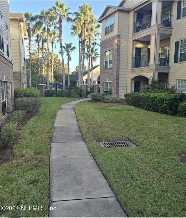 view of community with a lawn