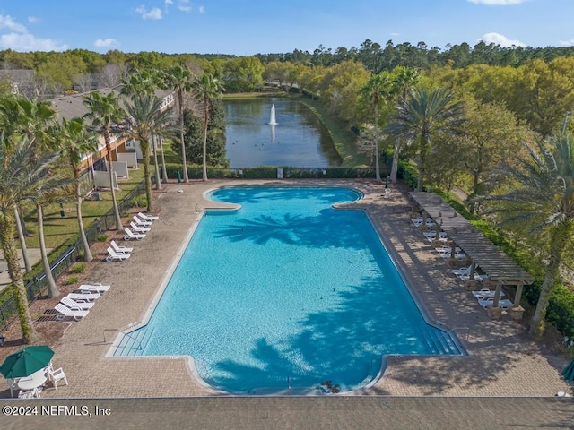 view of swimming pool with a water view