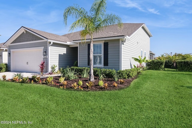 view of front facade featuring a front lawn and a garage