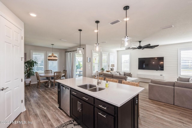 kitchen with pendant lighting, dishwasher, a healthy amount of sunlight, and ceiling fan