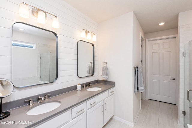 bathroom featuring vanity, walk in shower, and wooden walls