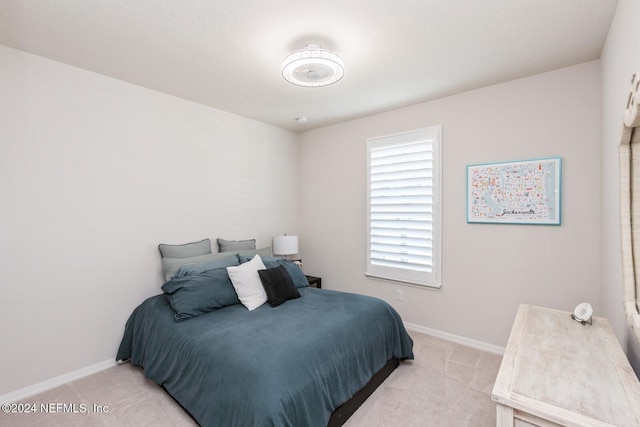 bedroom with light colored carpet