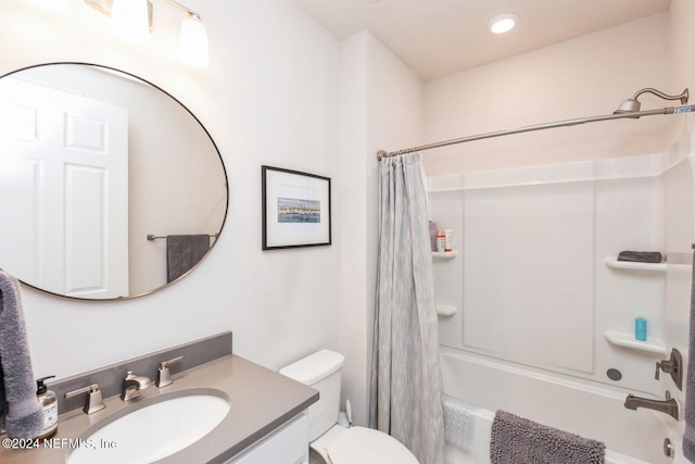 full bathroom featuring shower / bath combination with curtain, toilet, and vanity