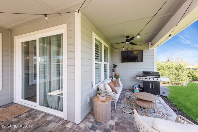 view of patio with ceiling fan and a grill