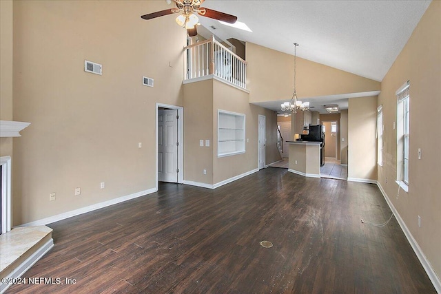 unfurnished living room featuring a textured ceiling, dark hardwood / wood-style floors, ceiling fan with notable chandelier, and high vaulted ceiling