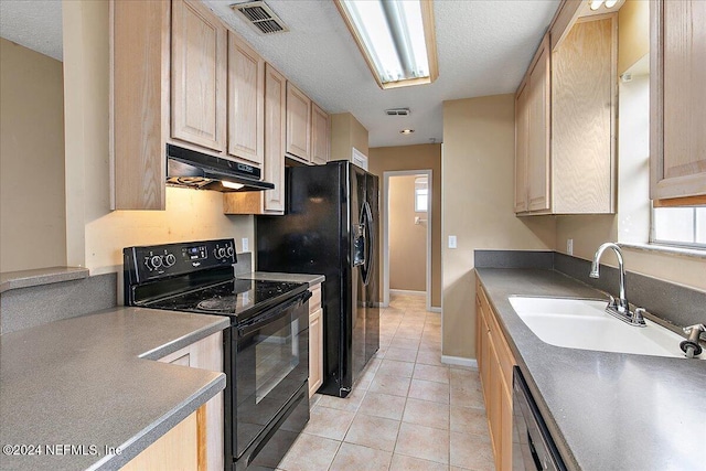 kitchen with light brown cabinets, sink, stainless steel dishwasher, black / electric stove, and light tile patterned flooring