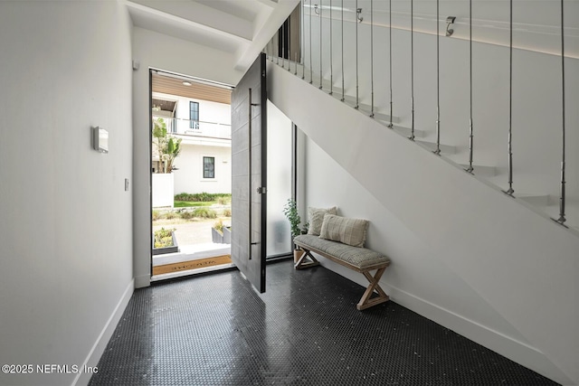 1304 Strand St, Neptune Beach, FL 32266 - entrance foyer with baseboards and stairway