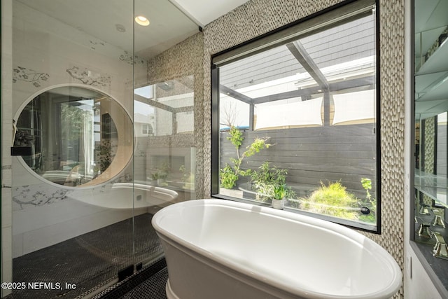 1304 Strand St, Neptune Beach, FL 32266 - bathroom featuring a freestanding tub, a walk in shower, and recessed lighting