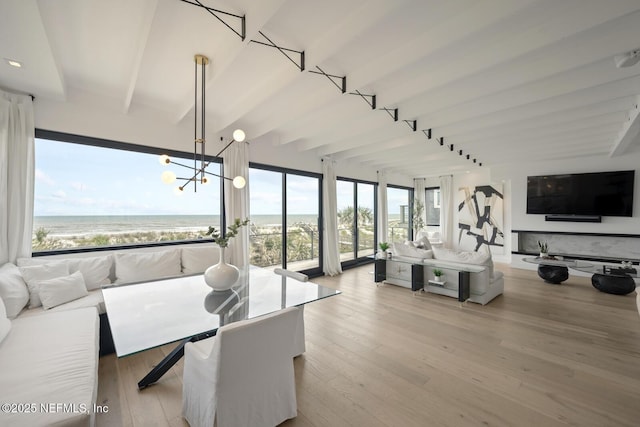 1304 Strand St, Neptune Beach, FL 32266 - sunroom featuring beam ceiling, a water view, and a chandelier