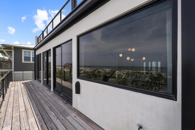 1304 Strand St, Neptune Beach, FL 32266 - wooden terrace featuring an attached garage