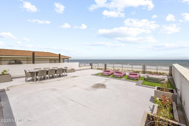 1304 Strand St, Neptune Beach, FL 32266 - view of patio featuring view of water and beach and outdoor dining area