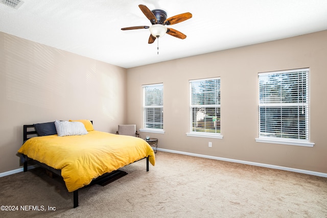 bedroom featuring ceiling fan and carpet floors