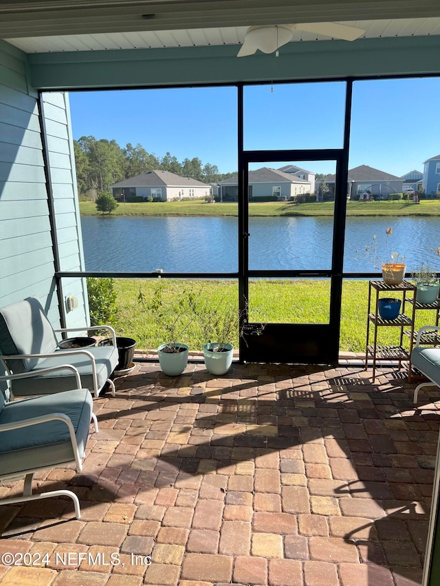 sunroom with a water view