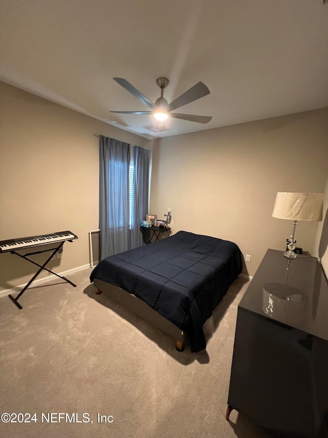 bedroom with light carpet and ceiling fan