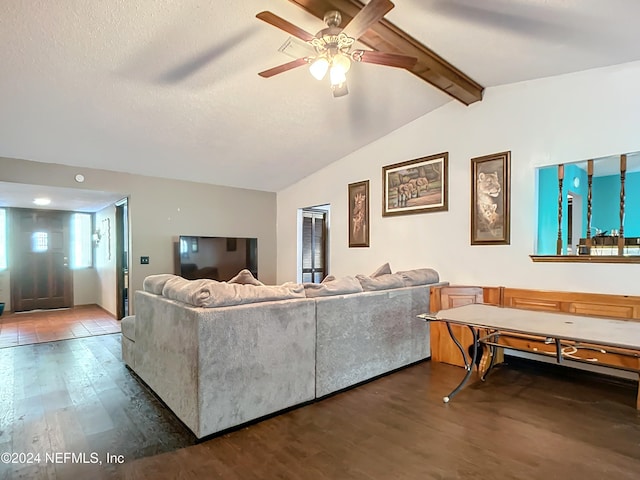 living room featuring a textured ceiling, vaulted ceiling with beams, ceiling fan, and dark hardwood / wood-style floors