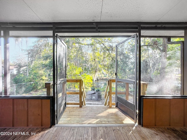 unfurnished sunroom with a healthy amount of sunlight