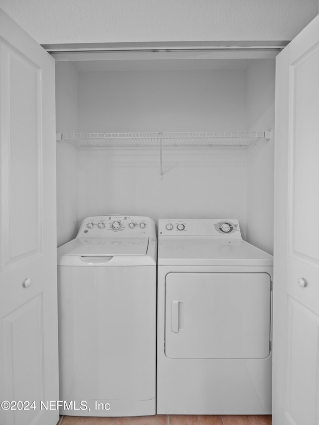 washroom featuring washer and dryer