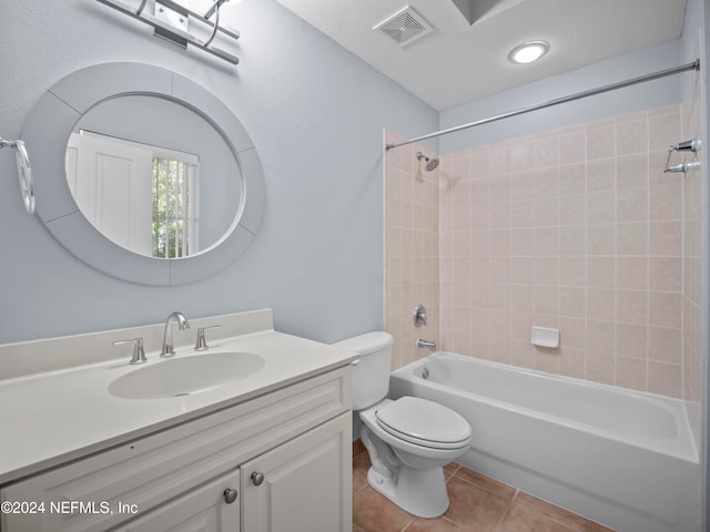 full bathroom with tile patterned floors, vanity, toilet, and tiled shower / bath