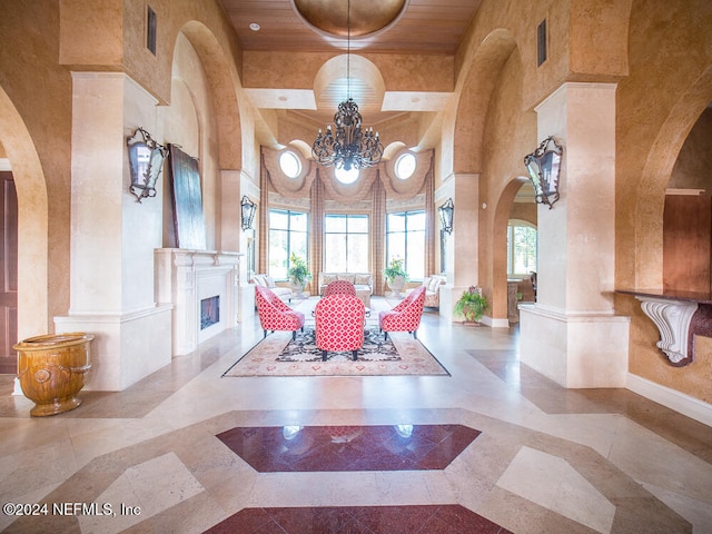 dining area featuring a chandelier and a high ceiling