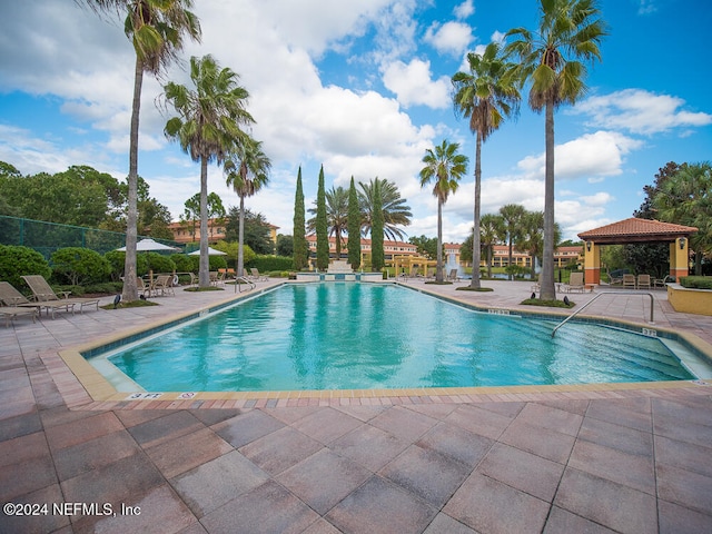 view of swimming pool featuring a gazebo and a patio area