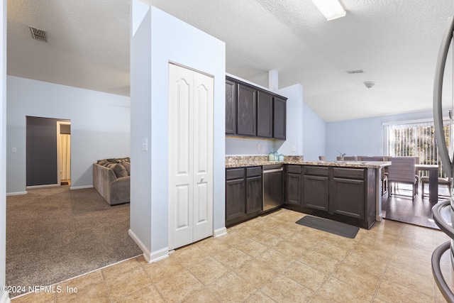 kitchen featuring dark brown cabinetry, sink, stainless steel dishwasher, kitchen peninsula, and a textured ceiling