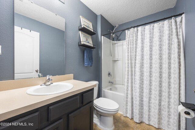 full bathroom with vanity, shower / bath combination with curtain, toilet, and a textured ceiling