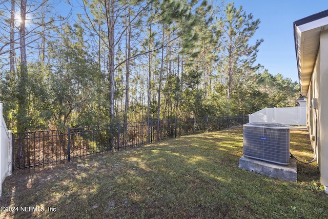 view of yard featuring central air condition unit